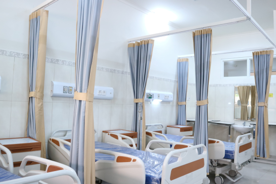 a hospital room with beds
