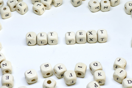 Photo of dice spelling out Alt Text